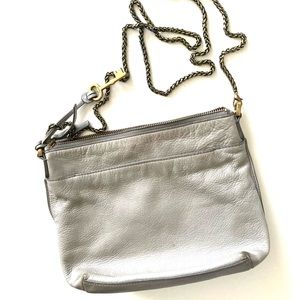 Fossil tan/gray leather crossbody bag. Removable brass chain.